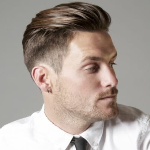 High Fade With Swept-Back Top High Fade With Swept-Back Top β Winter Haircuts for Men