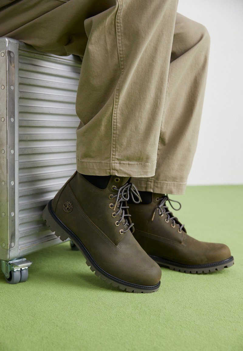 Olive Green Lace-Ups with Khaki Trousers: Utilitarian Chic — Timberland Boots Outfits