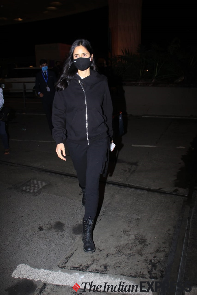 Monochrome Black Outfit with Combat Boots for a Sleek Airport Departure Monochrome Black Outfit with Combat Boots for a Sleek Airport Departure β Winter Airport Outfits