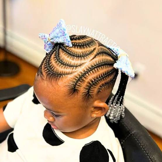 Curved Cornrows Into Pigtails With Blue Bow Curved Cornrows Into Pigtails With Blue Bow β Winter Hairstyles for Black Kids