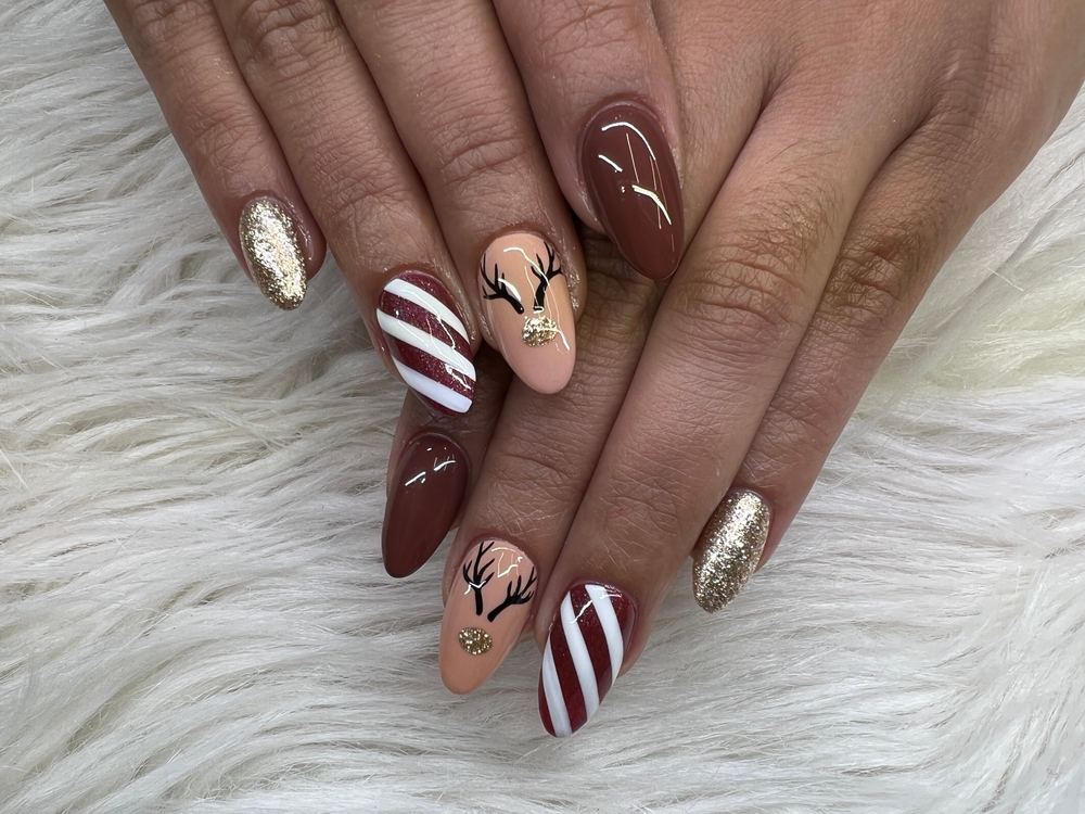 Gold Glitter Reindeer Stripe Almond Nails Gold Glitter Reindeer Stripe Almond Nails β Christmas Nails 2026