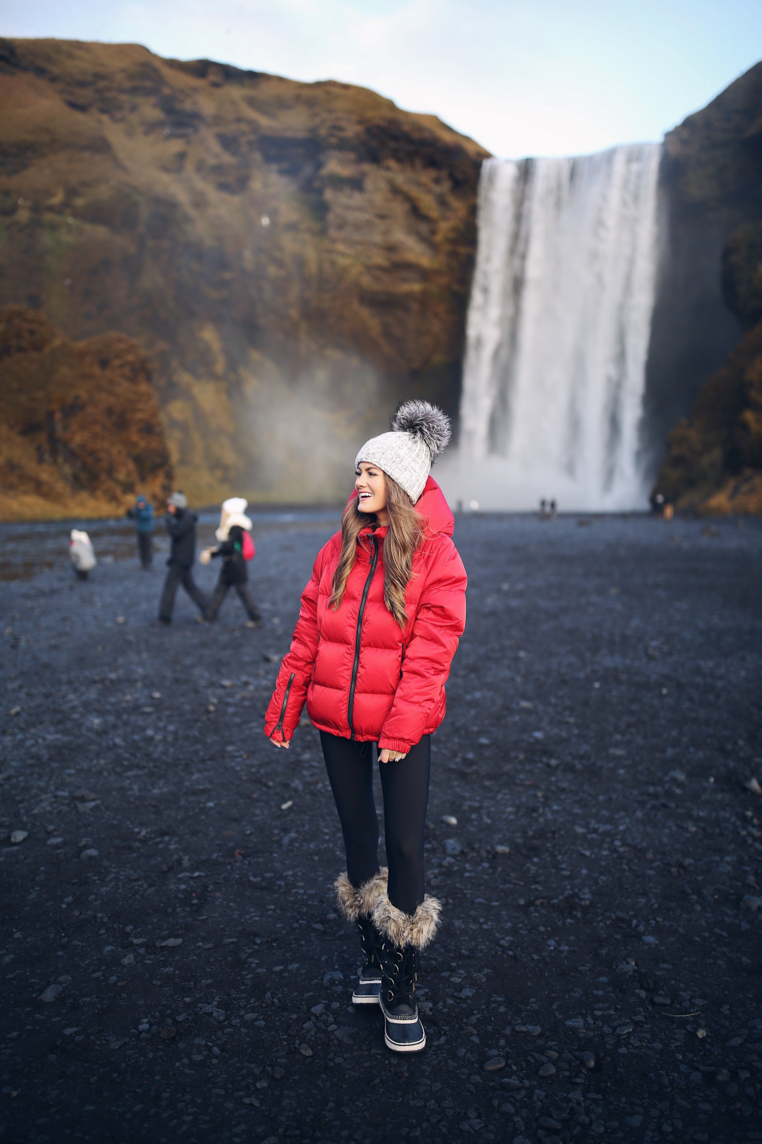 Red Puffer Jacket With Black Leggings And Fur-Trimmed Snow Boots Red Puffer Jacket With Black Leggings And Fur-Trimmed Snow Boots β Iceland Winter Outfits