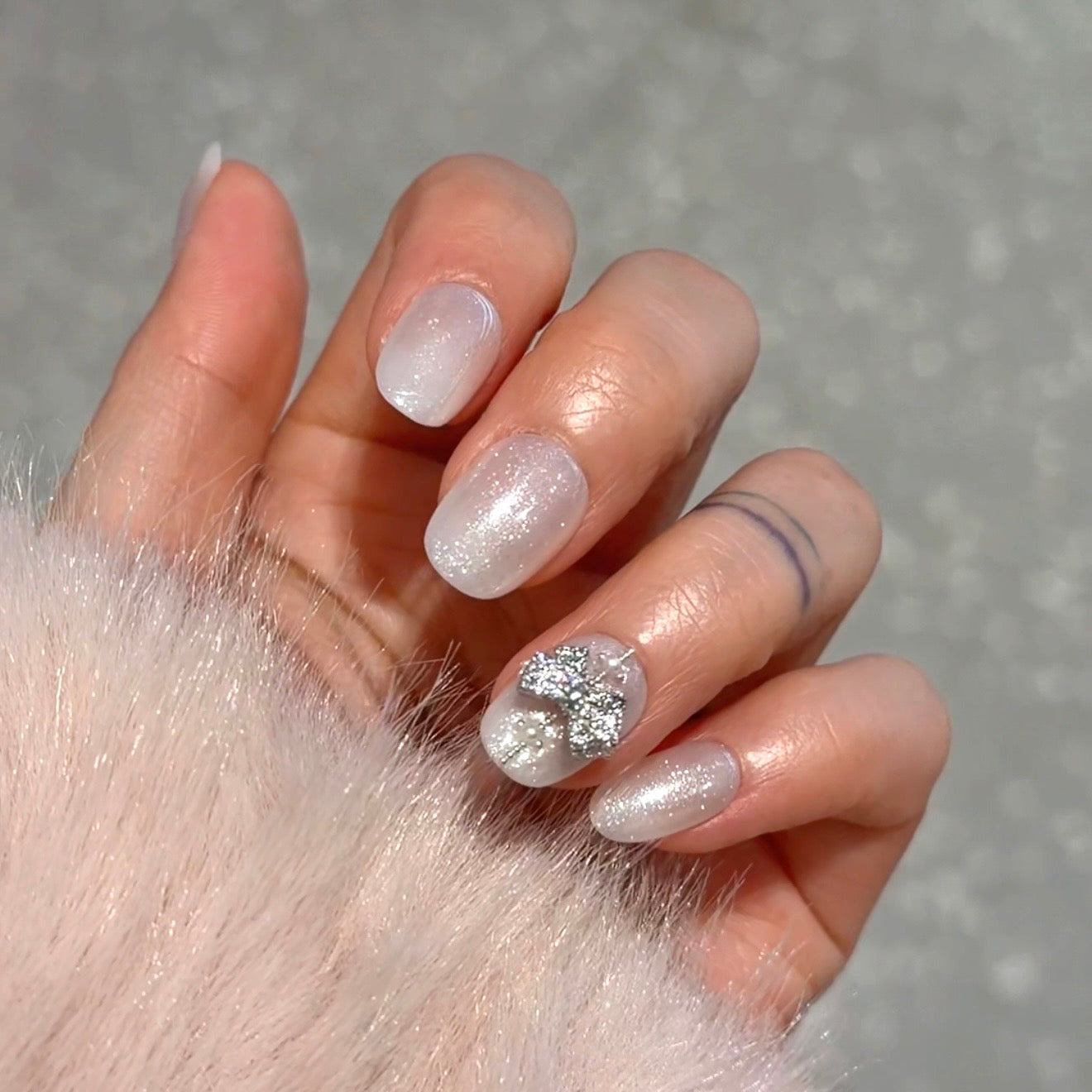 Shimmer Off-White with Crystal Bow Embellishment — Winter Glitter Nails