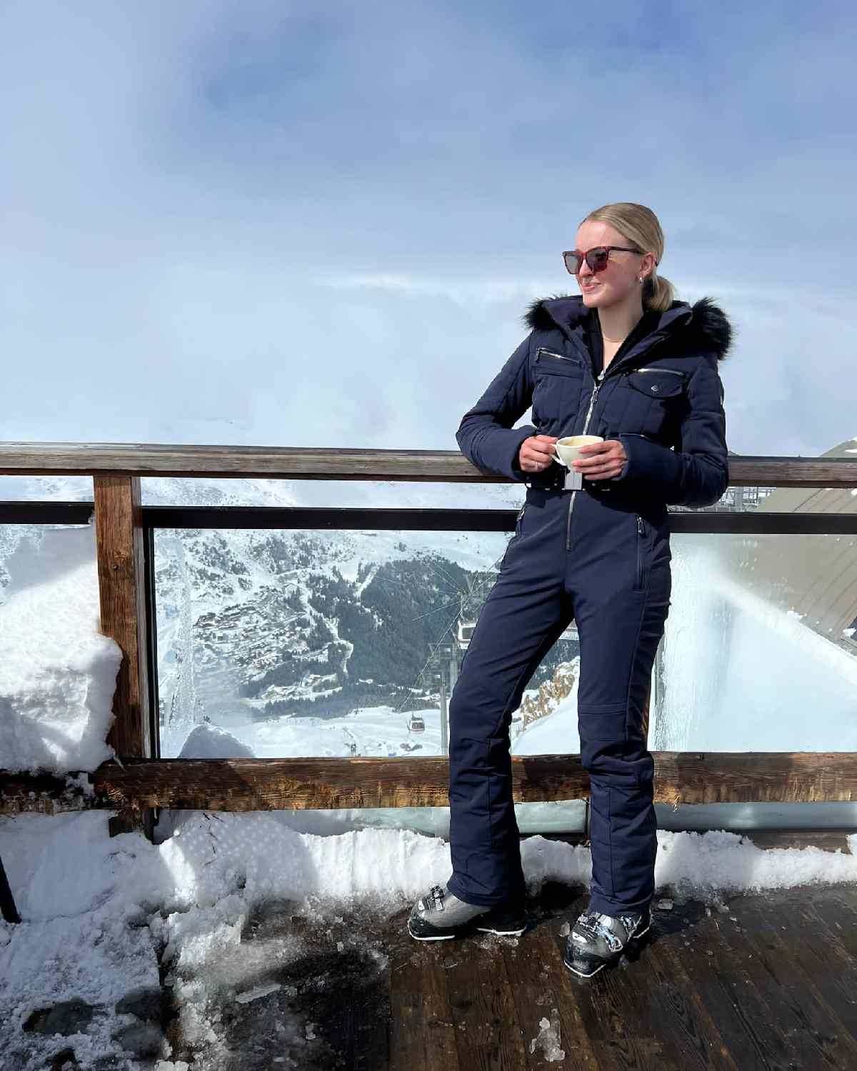 Chic Navy Ski Suit with Faux Fur-Trimmed Hood Chic Navy Ski Suit with Faux Fur-Trimmed Hood — Ski Outfits