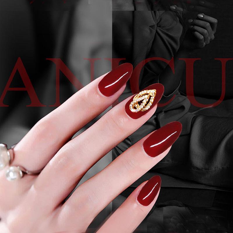 Medium Oval Burgundy with Gold Swirl Accent Medium Oval Burgundy with Gold Swirl Accent β Burgundy Christmas Nails 2026