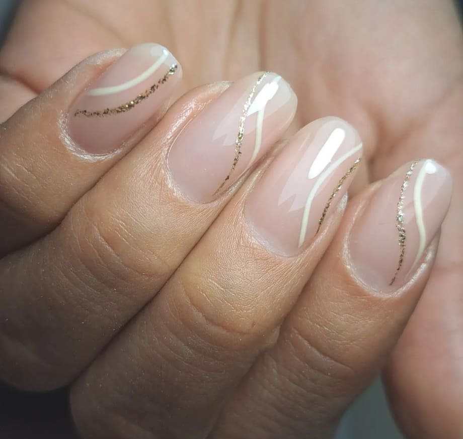 Sheer Pink Oval Nails with Gold Glitter Lines Sheer Pink Oval Nails with Gold Glitter Lines β Short Winter Oval Nails