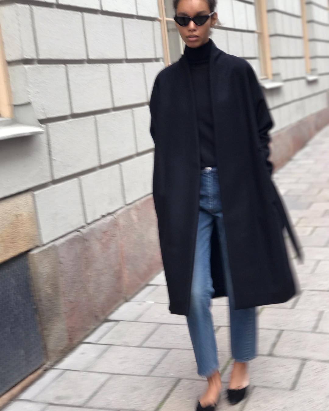Black Wool Coat with Blue Jeans and Flats — Minimalist Winter Outfits