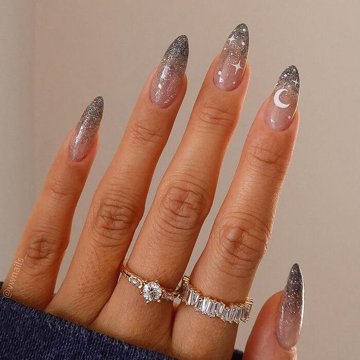 Long Stiletto Glitter Gradient with Celestial Motifs — Winter Glitter Nails