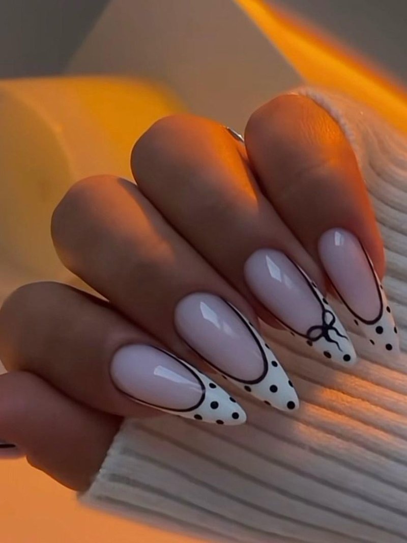 Long Stiletto Nude with Black Polka Dot Bow Design Long Stiletto Nude with Black Polka Dot Bow Design β Winter Work Nails
