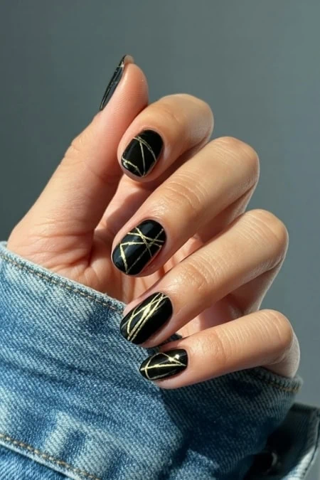 Glossy Black with Abstract Gold Lines Glossy Black with Abstract Gold Lines β New Years Eve Nails 2027