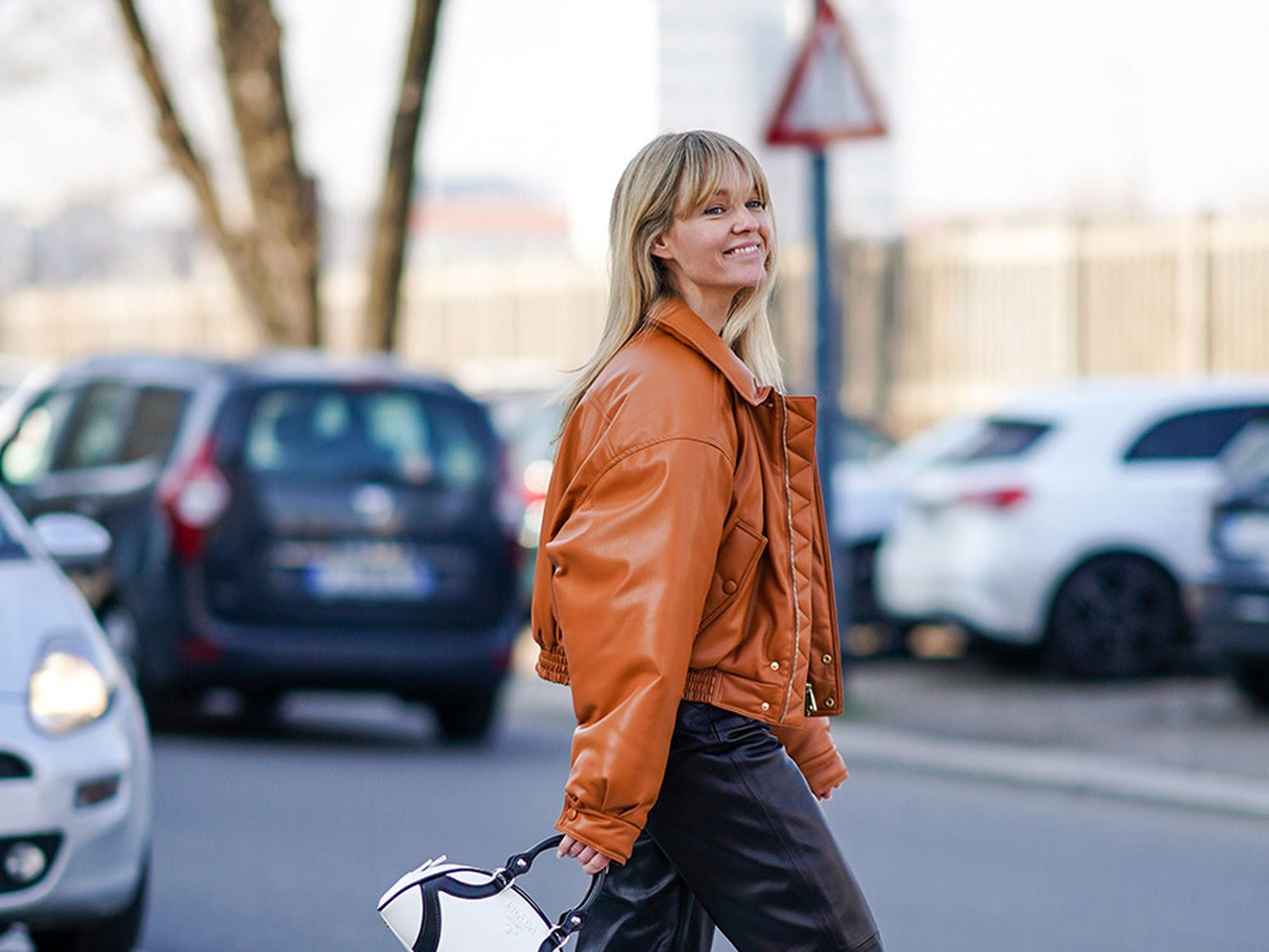 Black Leather Pants with Collared Shirt, Tan Bomber Jacket, and Lace-Up Boots — Leather Pants Outfits