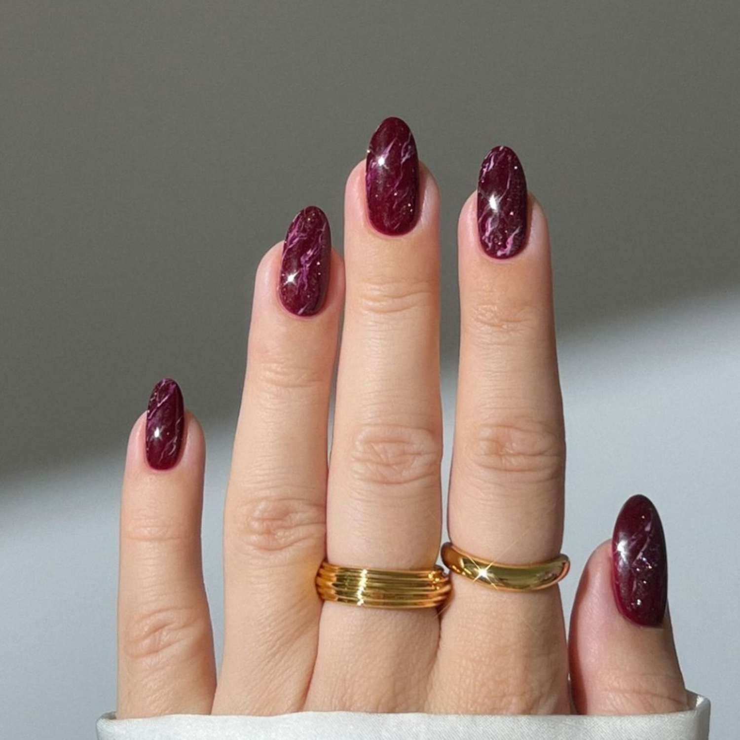 Shimmering Burgundy Marble on Almond Nails — Winter Marble Nails