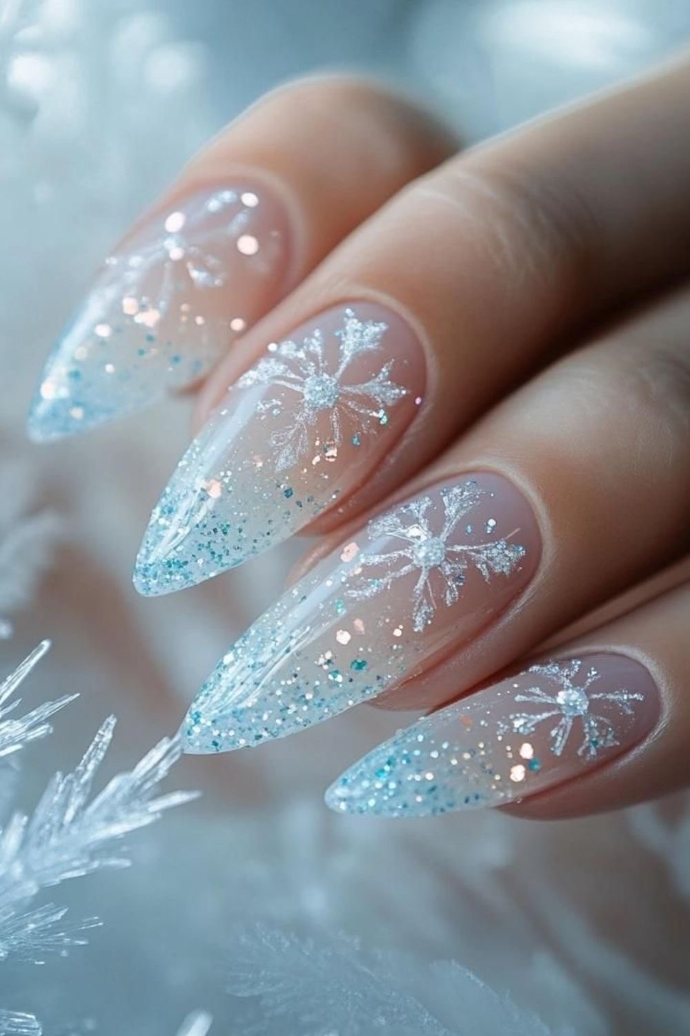Sheer Pink Almonds with Glitter Snowflakes Sheer Pink Almonds with Glitter Snowflakes β Snowflake Nails