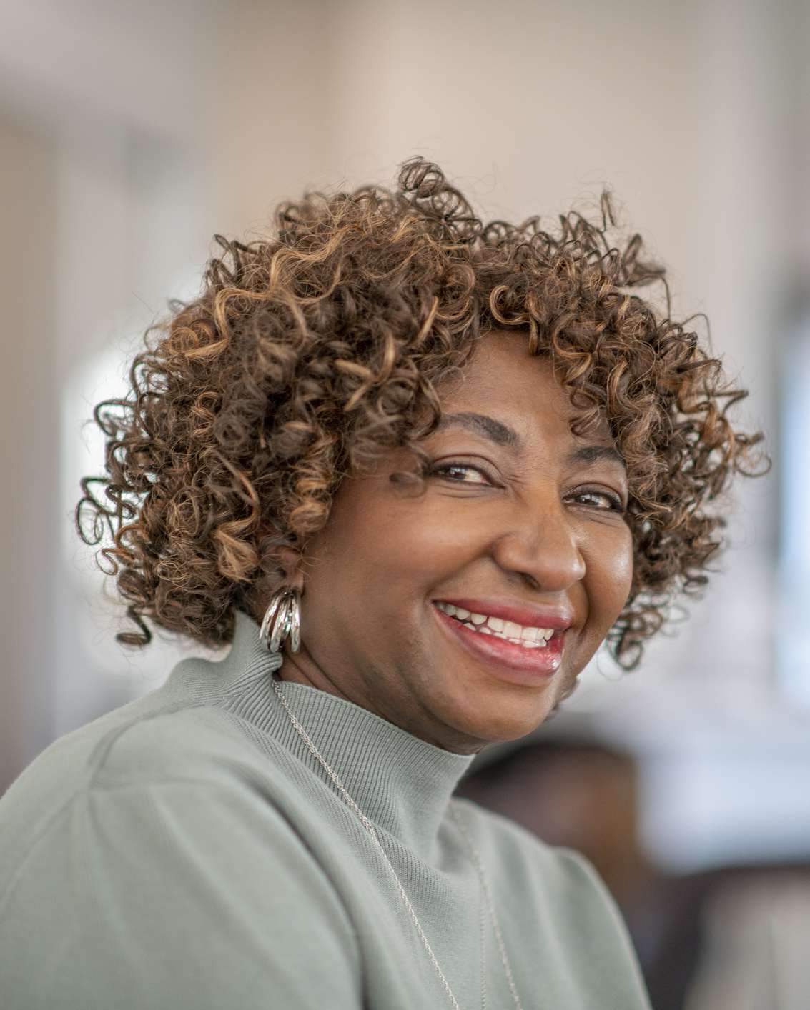 Short Curly Dark Brown with Caramel — Winter Hairstyles for Women Over 60