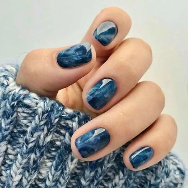 Deep Blue and Grey Marble Ovals Deep Blue and Grey Marble Ovals β Winter Nail Colors for Women Over 70