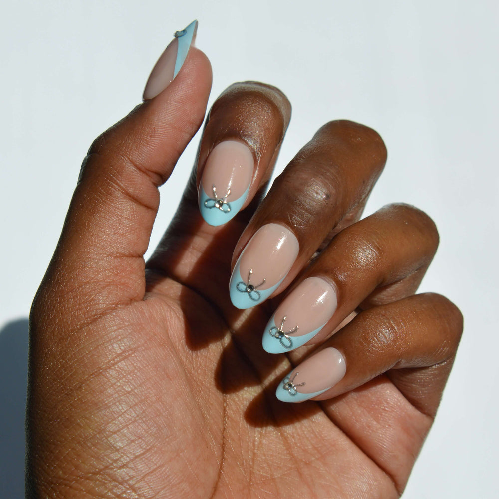 Medium Almond Baby Blue French with Silver Bows Medium Almond Baby Blue French with Silver Bows β Coquette Winter Nails