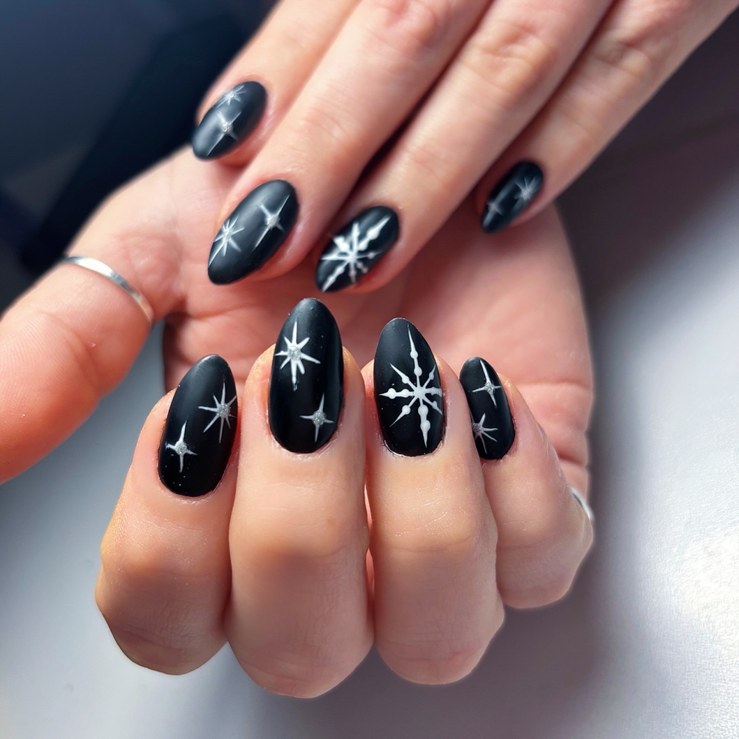 Matte Black with White Starburst and Snowflakes — Winter Black Nails