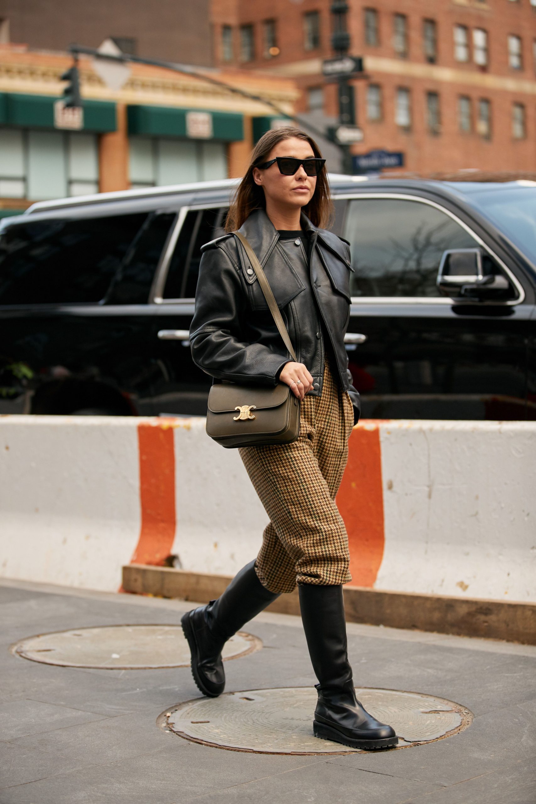 Edgy Street Style: Plaid Trousers with Black Leather Jacket and Mid-Calf Boots — Over the Knee Boots Outfits