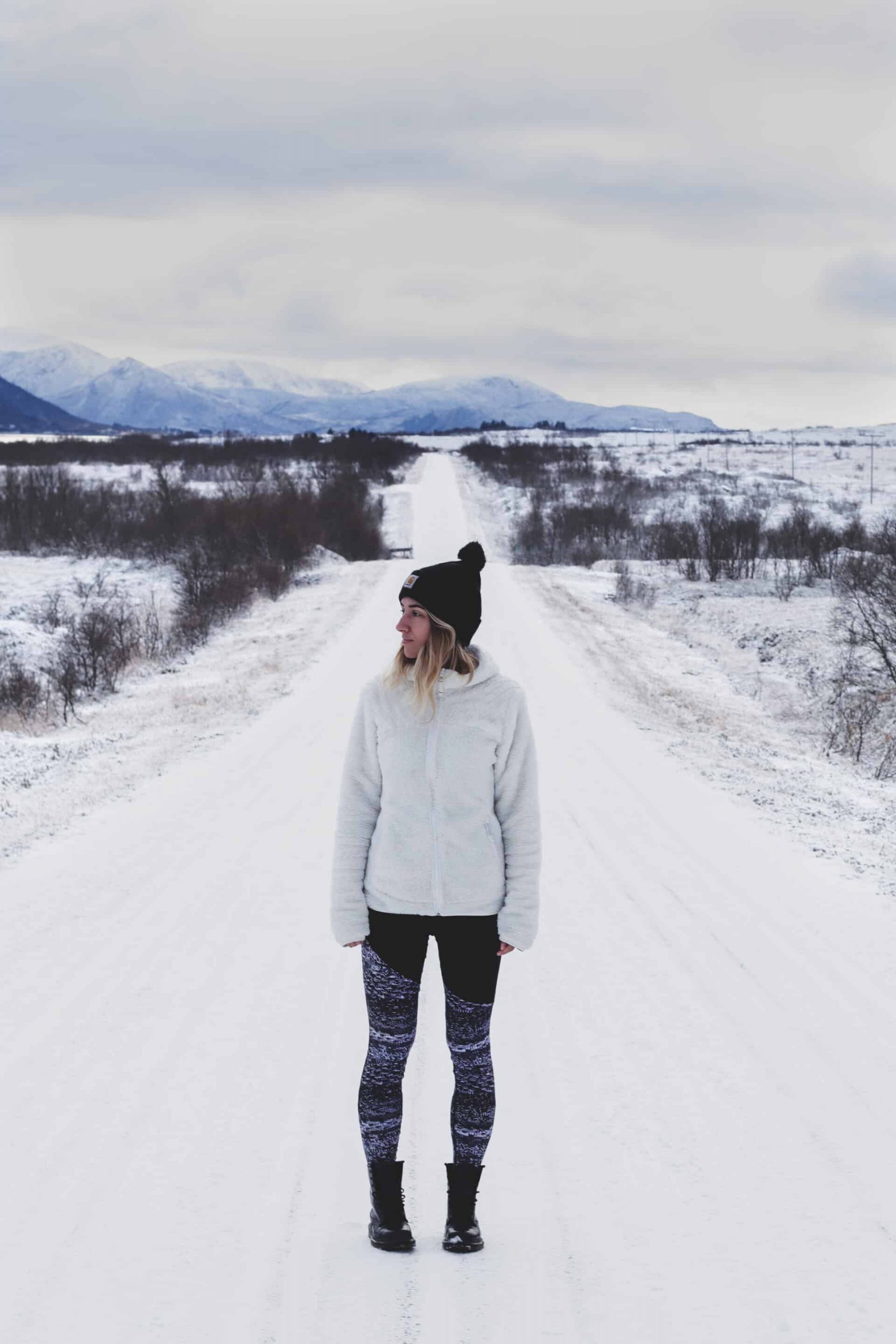 Rugged Warmth: Tan Parka with Red Accents — Snow Day Outfits