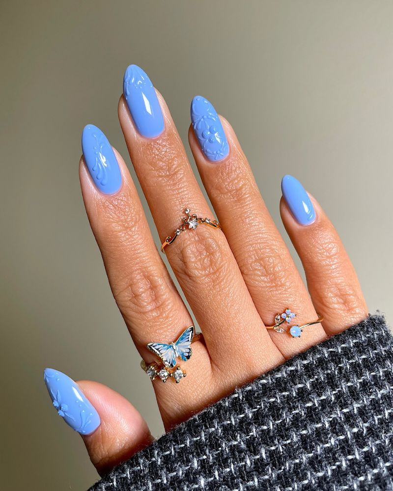 Periwinkle Blue Stiletto with Embossed Florals Periwinkle Blue Stiletto with Embossed Florals β Coquette Winter Nails