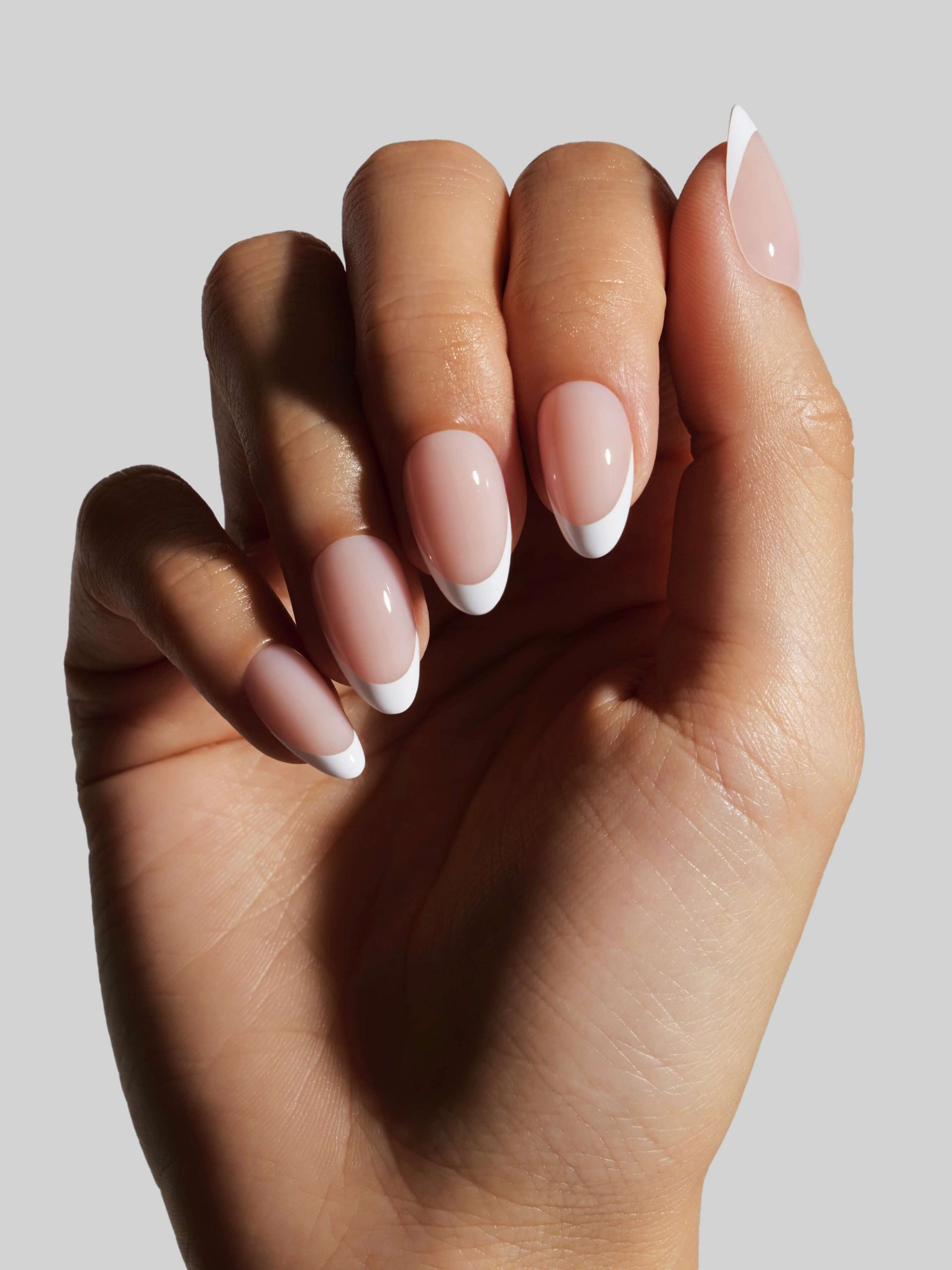 Sheer Pink Base With Opaque White Tips Visual Idea — Short Winter Almond Nails