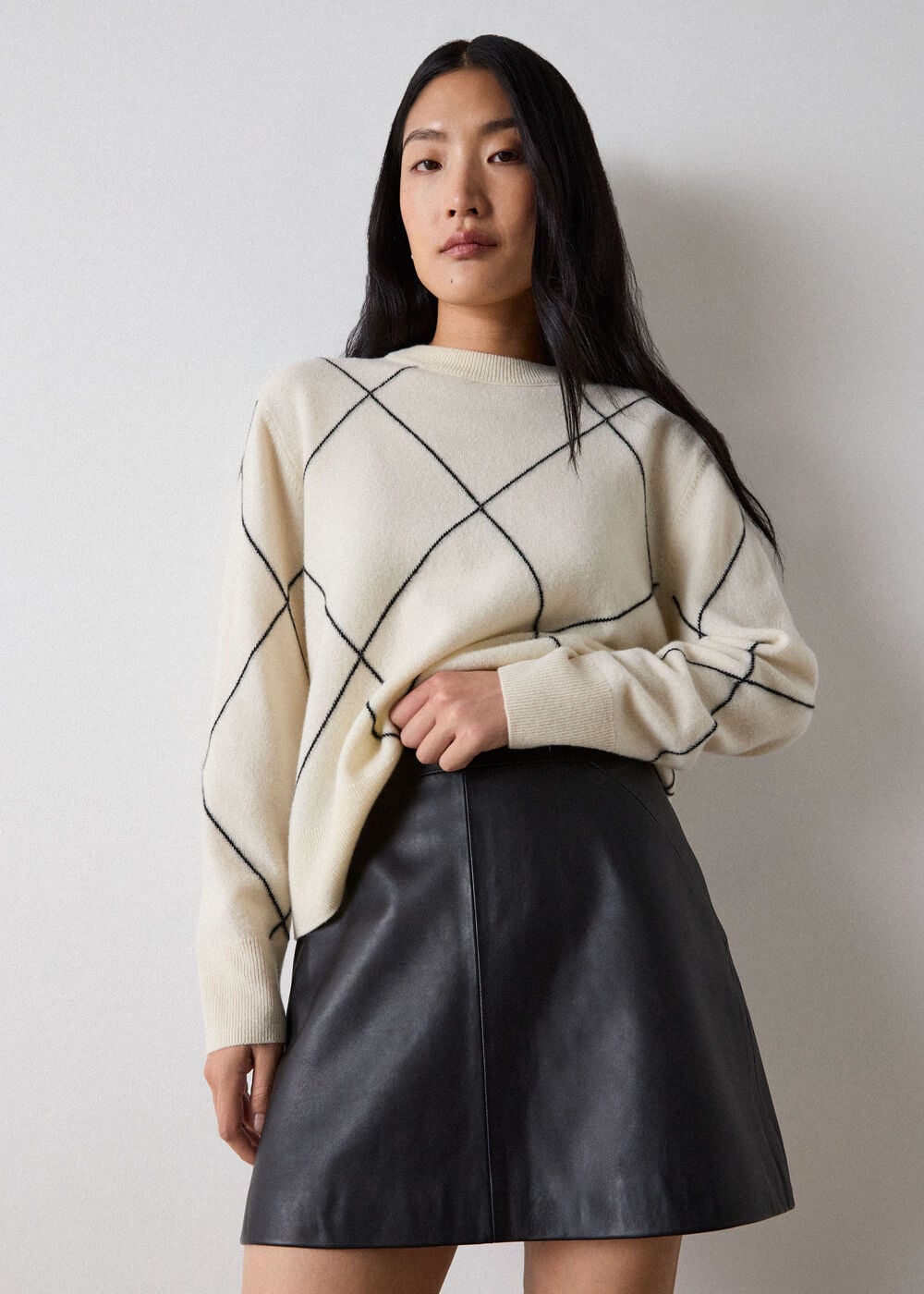 Black Leather A-line Mini Skirt with Cream Argyle Sweater — Leather Skirt Outfits