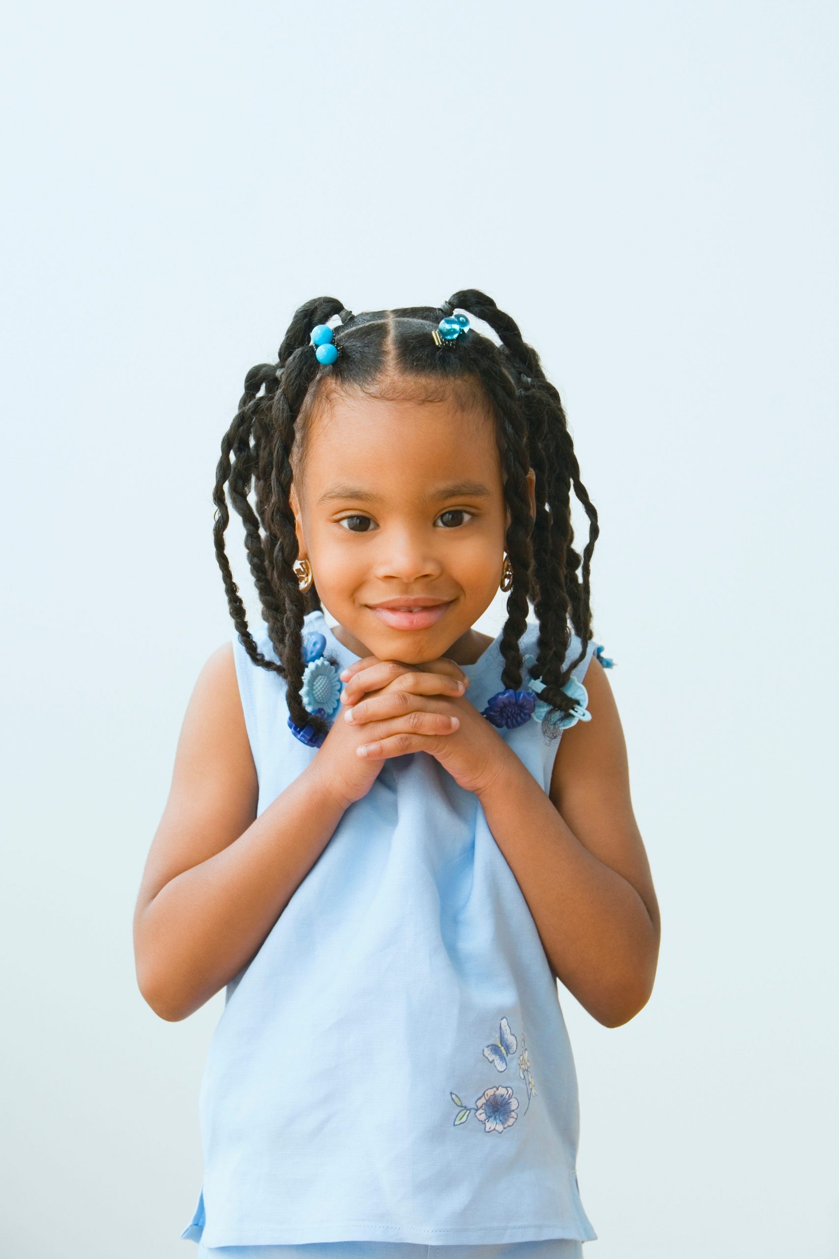 Curly Pigtails With Blue Beads Curly Pigtails With Blue Beads β Winter Hairstyles for Black Kids