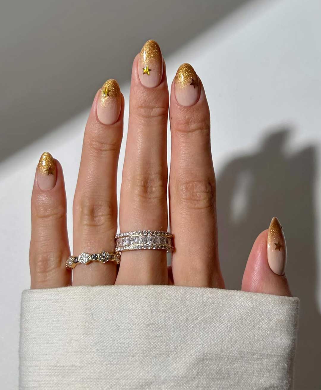 Nude Almond with Gold Glitter Gradient — Simple New Years Nails 2027