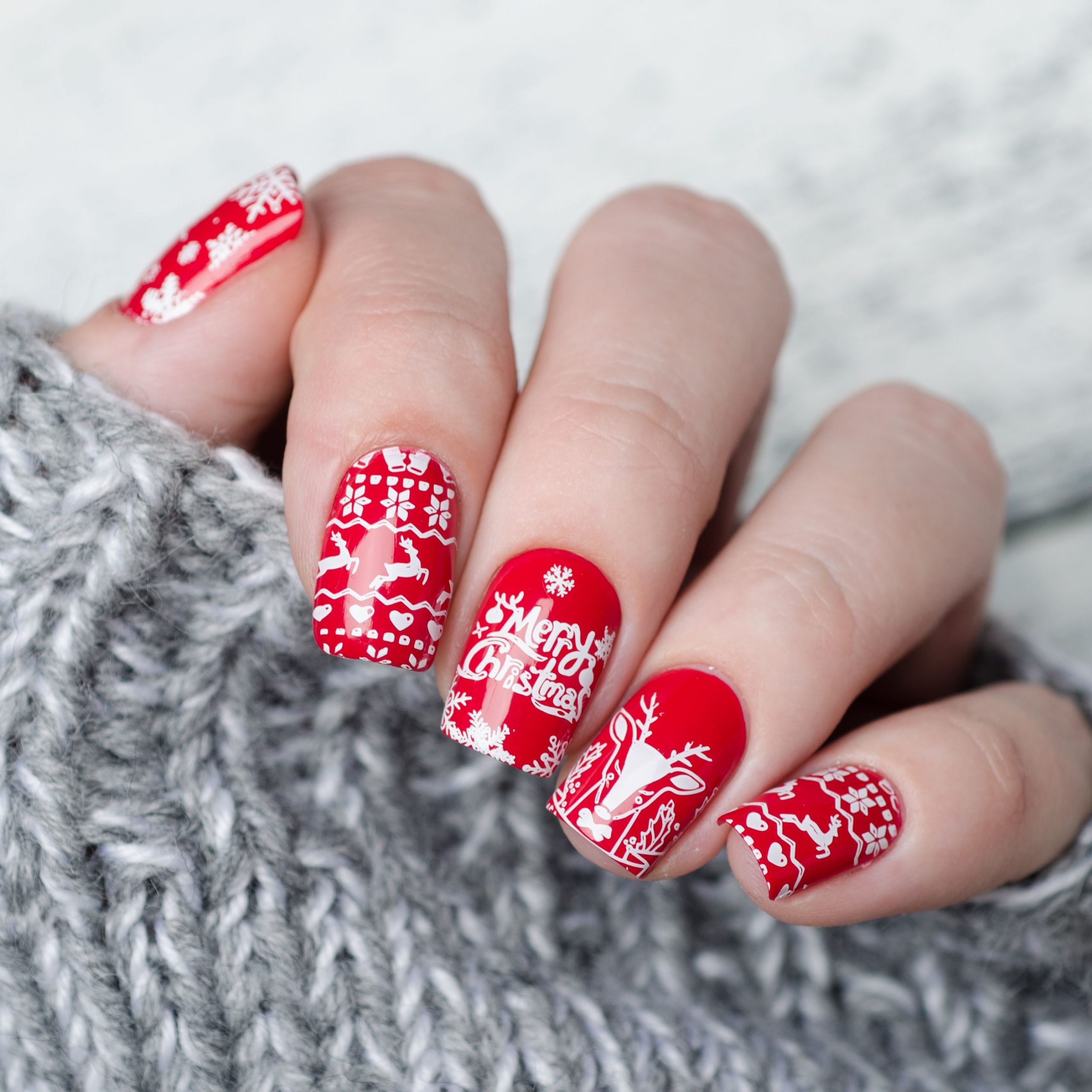 Bright Red with White Holiday Decals Short Oval — Winter Nail Colors for Short Nails