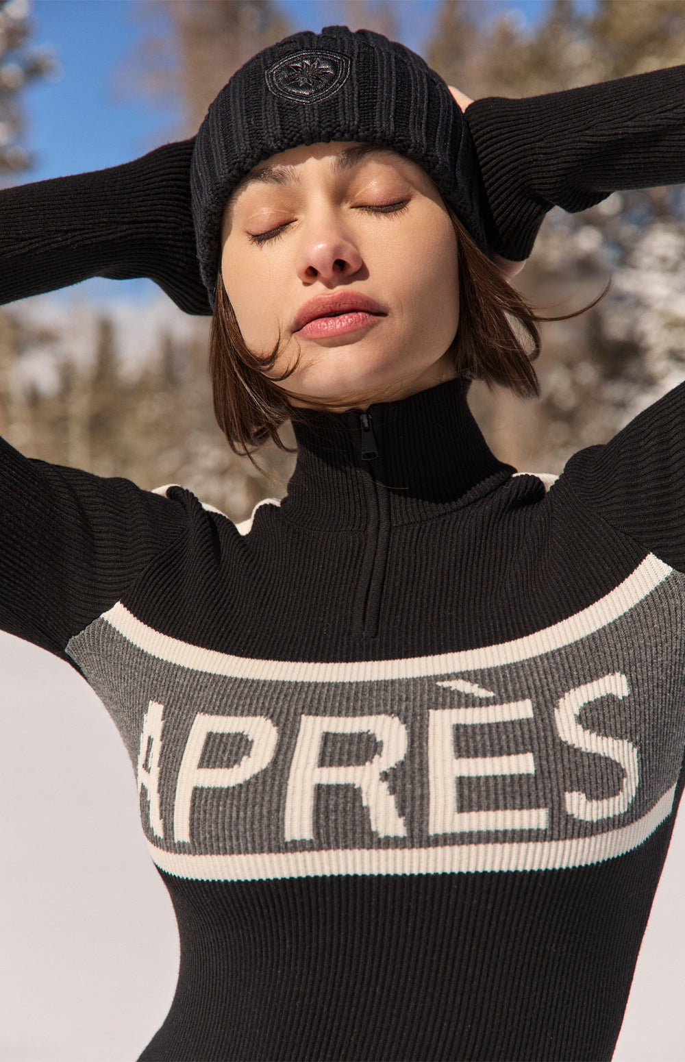 Graphic 'APRΓS' Turtleneck and Black Ski Pants for a Minimalist Look Graphic 'APRΓS' Turtleneck and Black Ski Pants for a Minimalist Look β Apres Ski Outfits