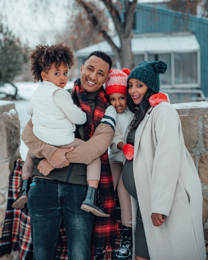 Festive Plaid and Puffer: Red Scarf and Beanie for a Snowy Family Portrait Festive Plaid and Puffer: Red Scarf and Beanie for a Snowy Family Portrait β Winter Family Photo Outfits