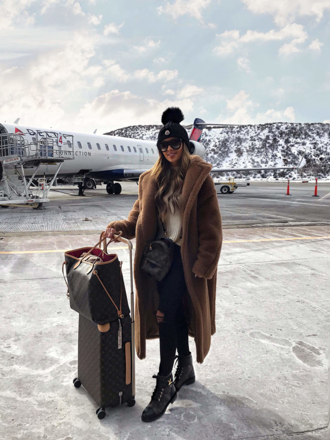 Cozy Teddy Coat Over Jeans for Airport Travel Comfort — Winter Travel Outfits