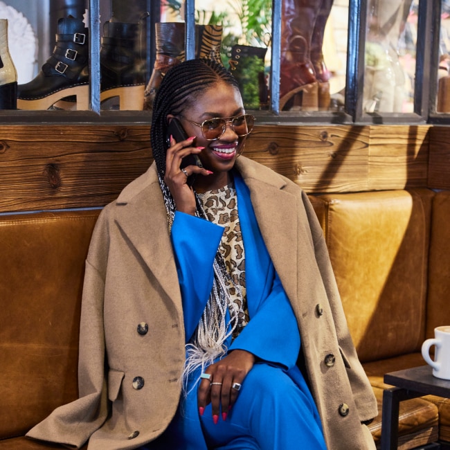 Sophisticated Camel Coat Over a Royal Blue Suit — Winter Layering Outfits