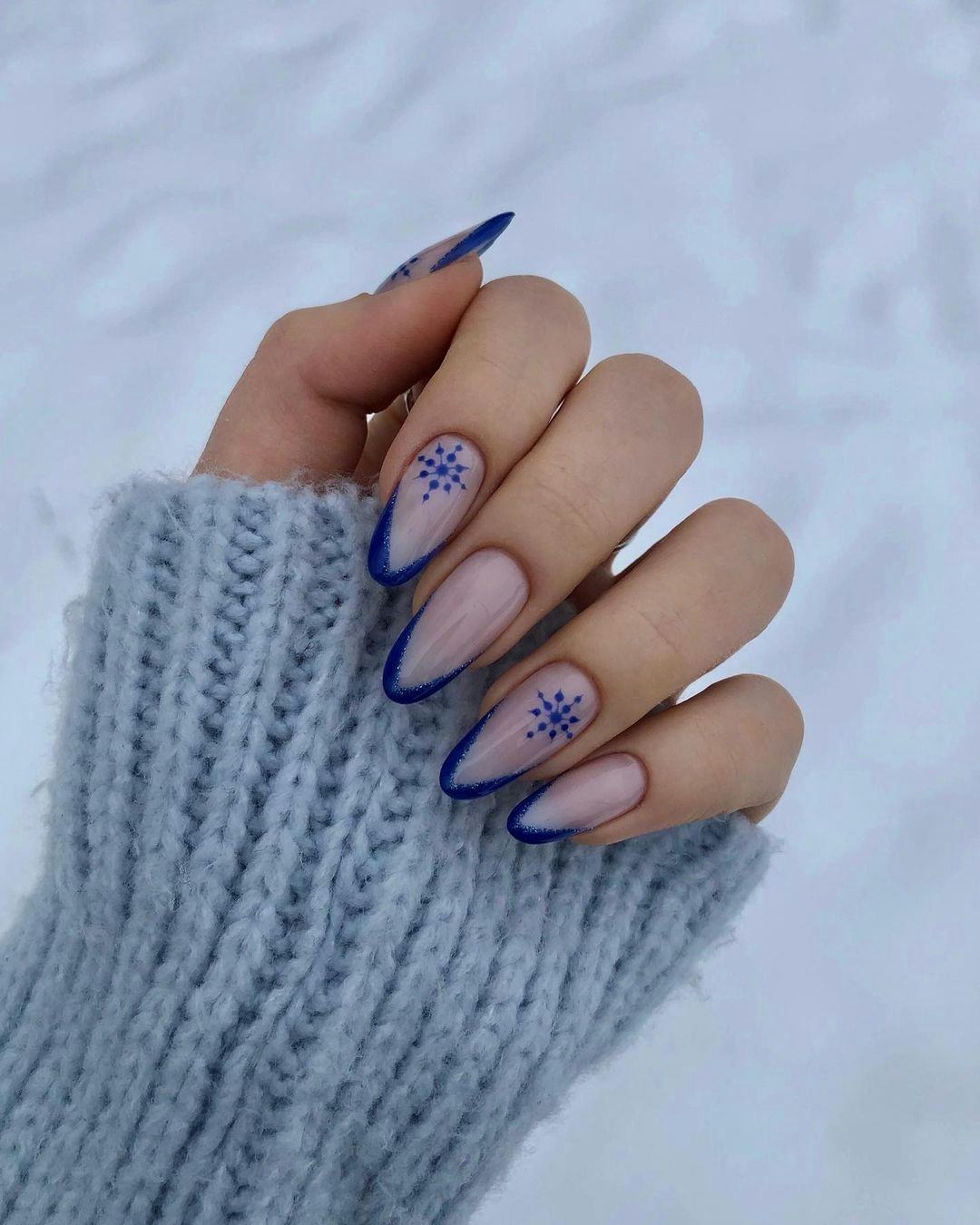 Nude with Blue French and Snowflakes Nude with Blue French and Snowflakes β Clean Girl Winter Nails