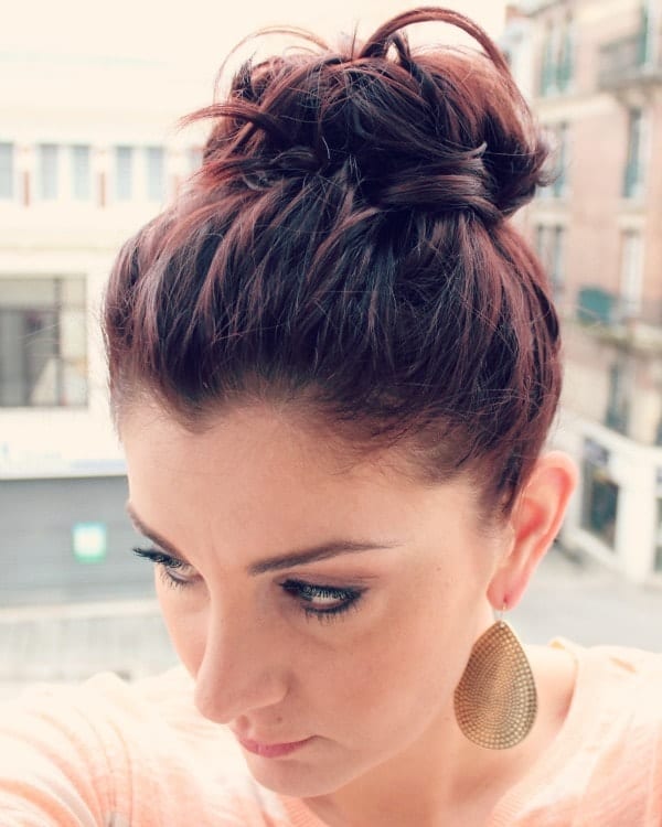 Messy Bun With Auburn Undertones — Cute Winter Hairstyles