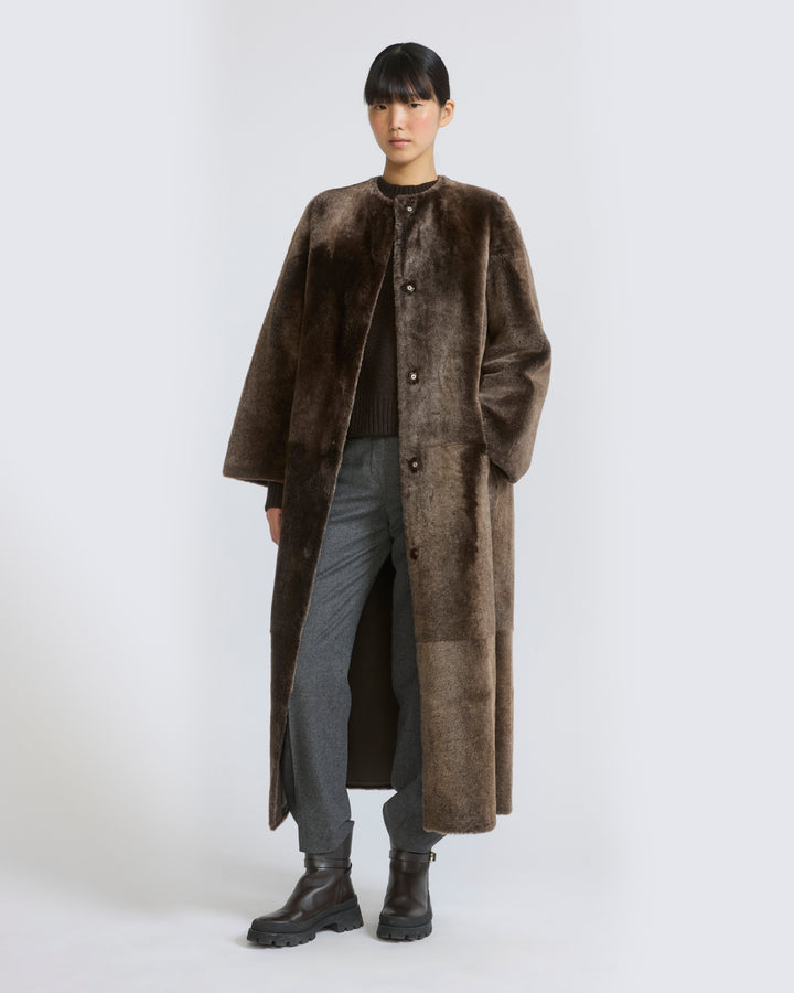 Longline Brown Shearling Coat Over Sweater and Trousers — Shearling Coat Outfits