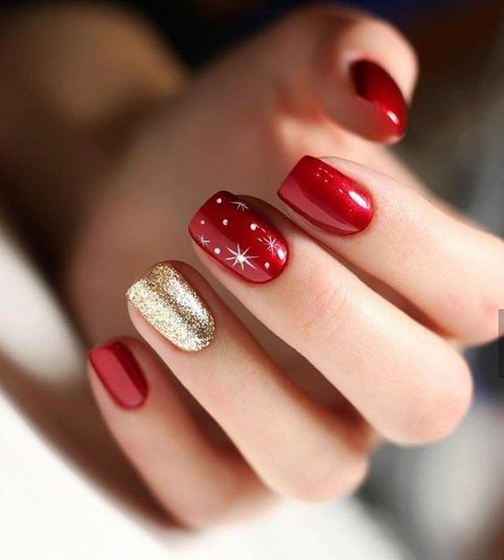 Short Square Red with Gold Glitter and White Starbursts — Red Christmas Nails 2026