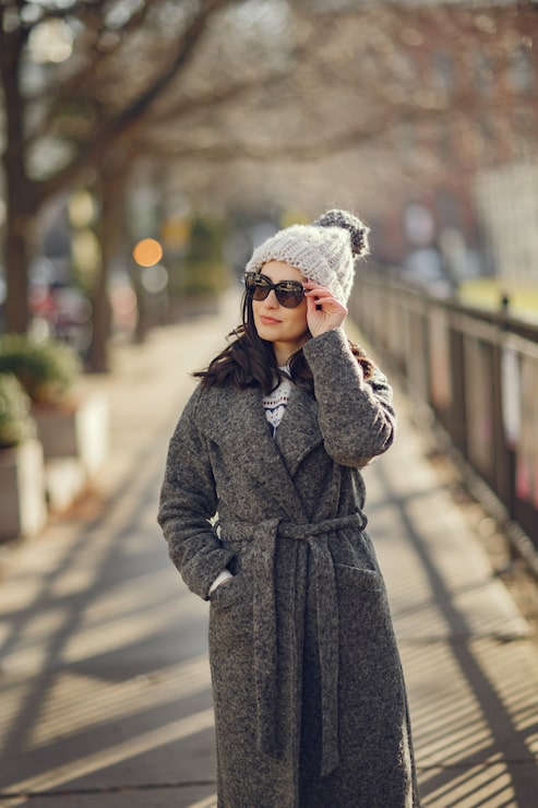 Black Puffer Jacket with White Scarf and Tan Boots Black Puffer Jacket with White Scarf and Tan Boots β Winter Outfits for Women Over 70
