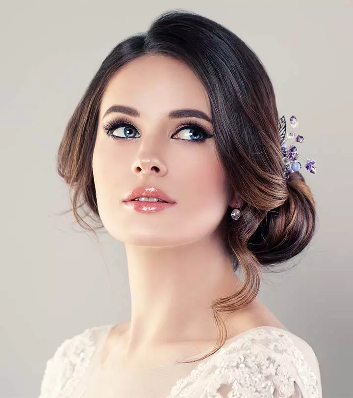 Low Chignon With Curled Tendrils Low Chignon With Curled Tendrils β Winter Formal Hairstyles