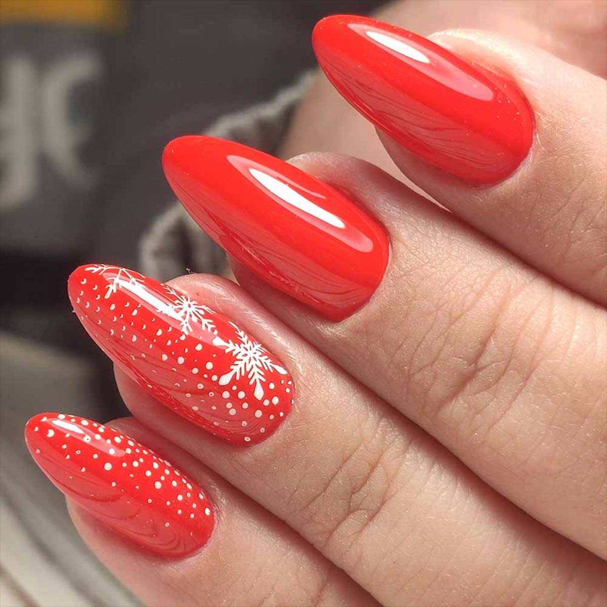 Glossy Red with White Snowflakes and Dots Glossy Red with White Snowflakes and Dots β Christmas Almond Nails 2026