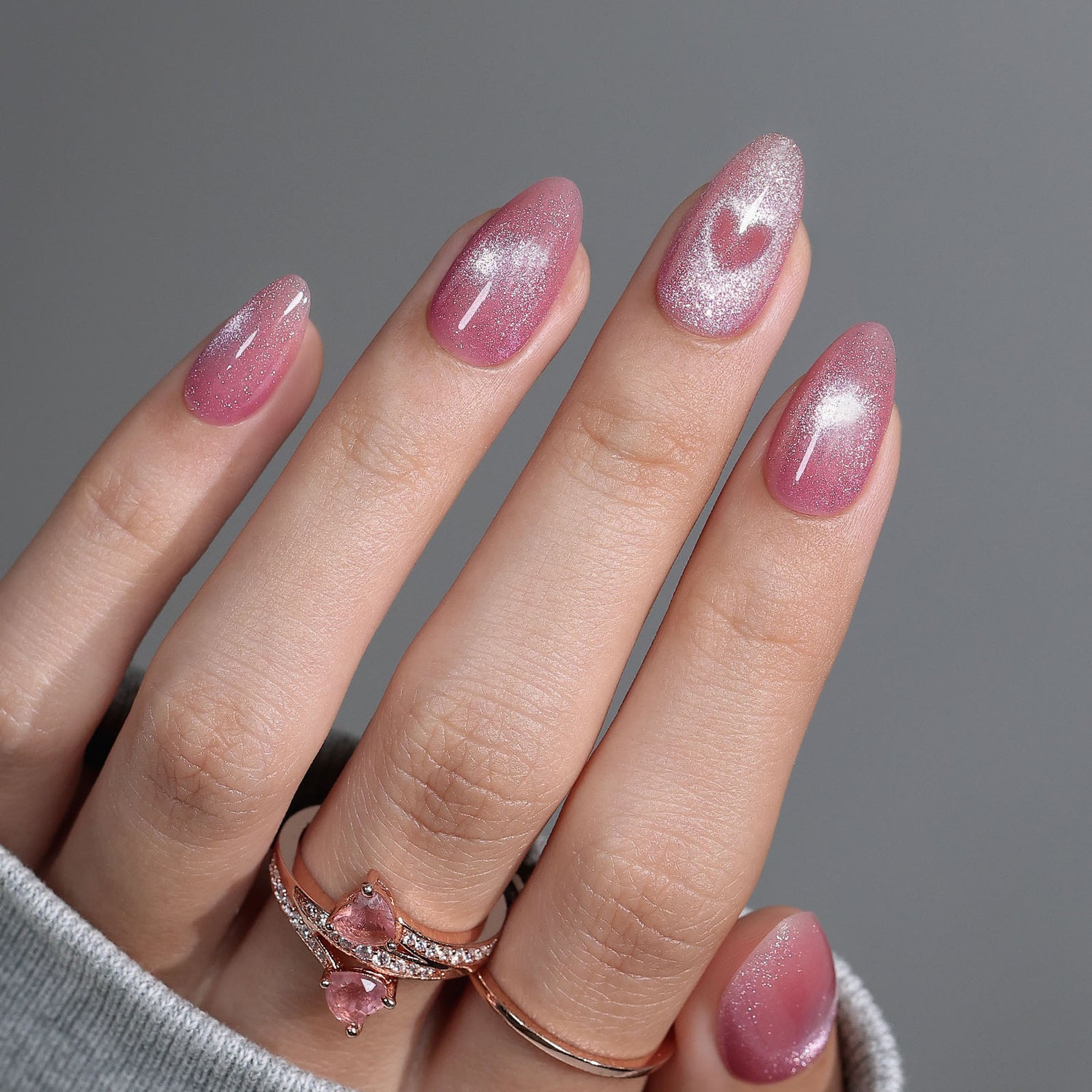 Shimmering Pink Cat-Eye with Heart Detail Shimmering Pink Cat-Eye with Heart Detail β New Years Almond Nails 2027