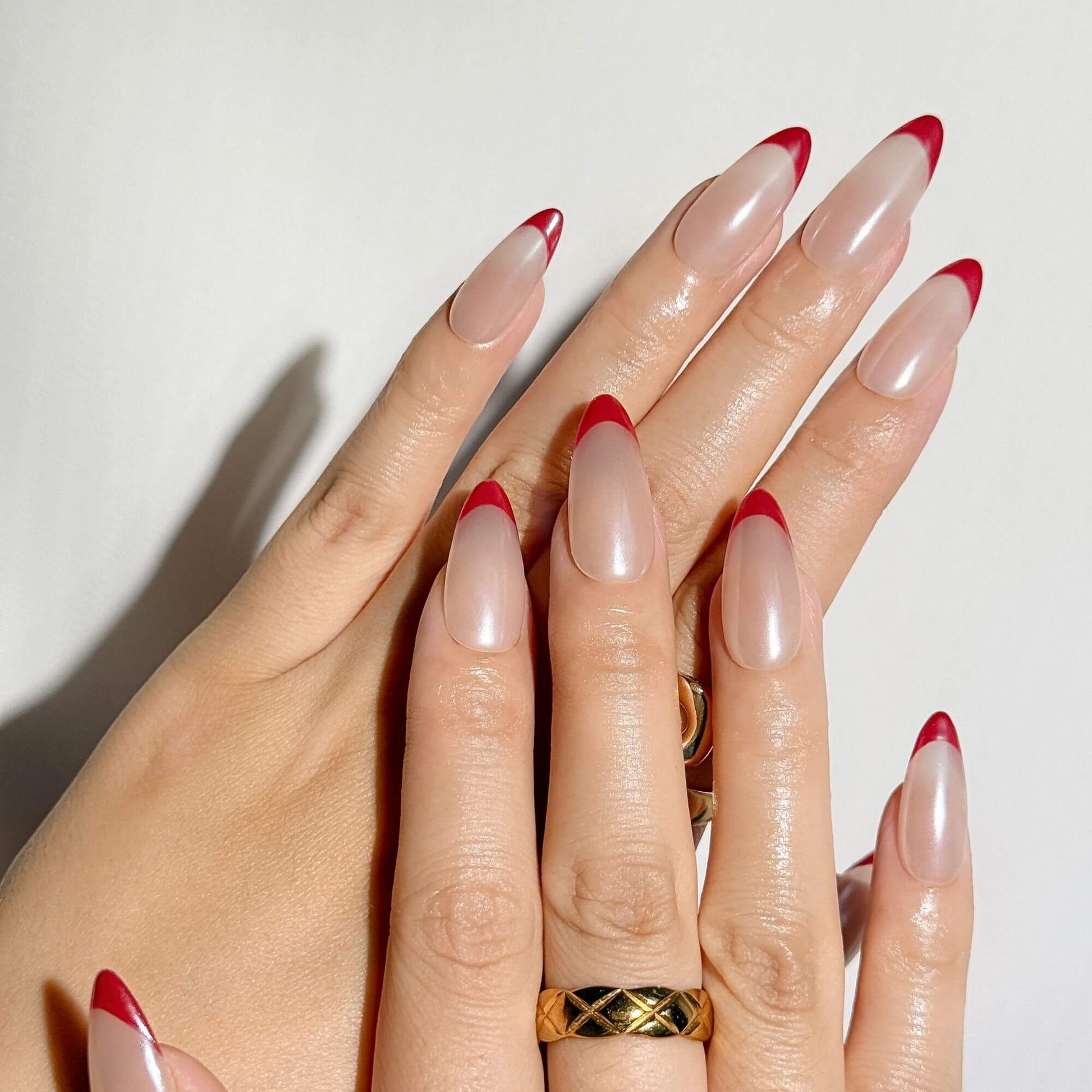 Sheer Nude with Vibrant Red French Tips Sheer Nude with Vibrant Red French Tips β Coquette Winter Nails