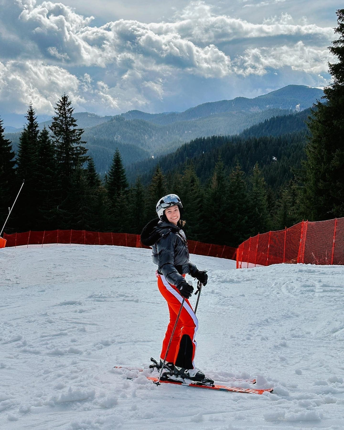 Skiing Black Puffer Jacket with Bright Orange Ski Pants Skiing Black Puffer Jacket with Bright Orange Ski Pants — Ski Outfits
