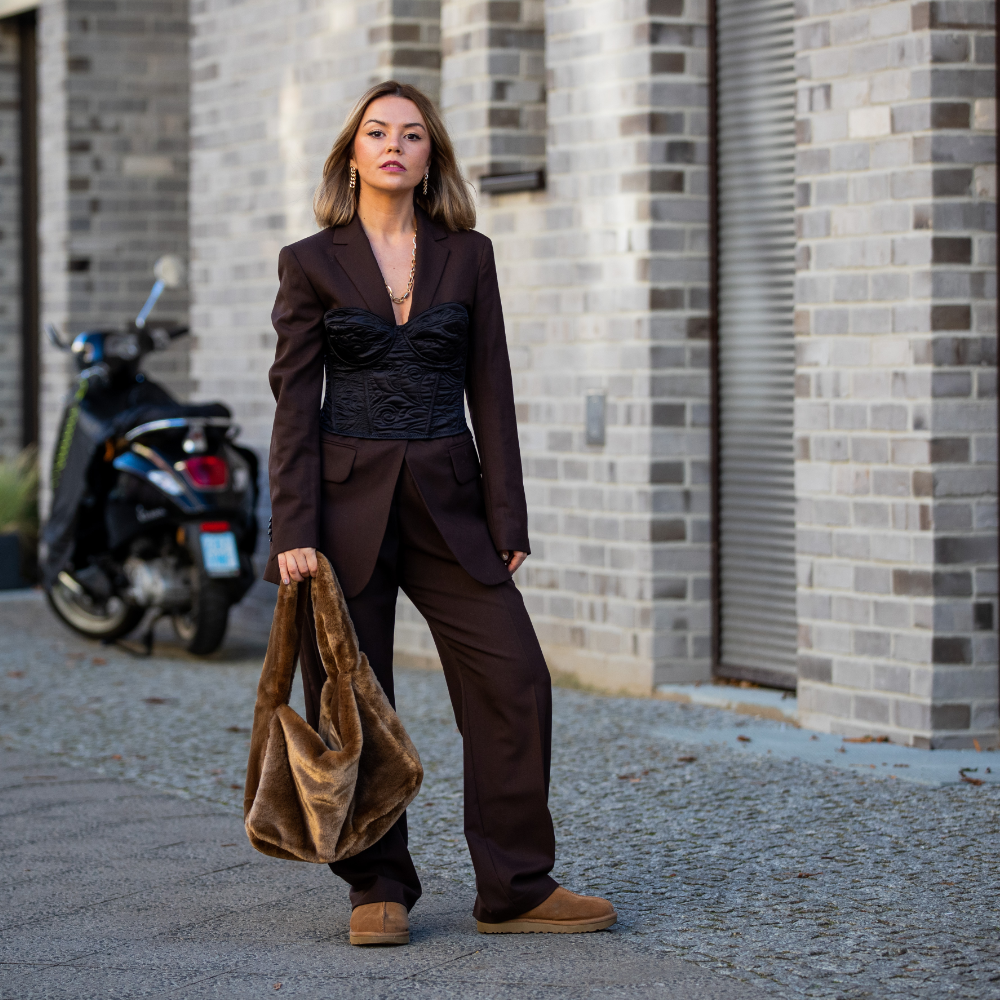 Modern Contrast: Taupe Uggs with Brown Suit and Corset Top Modern Contrast: Taupe Uggs with Brown Suit and Corset Top β Ugg Slippers Outfits