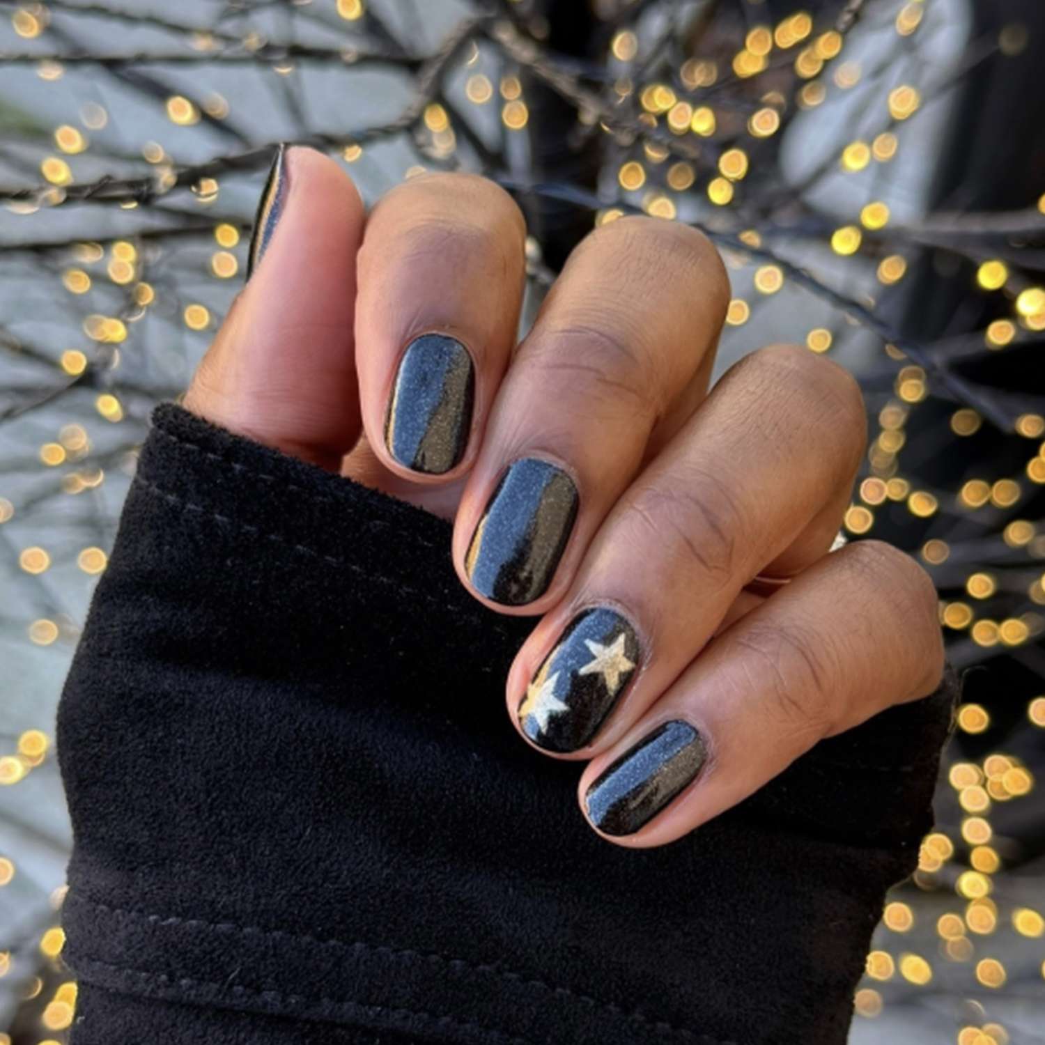 Glossy Black with Gold Star Accents — New Years Gel Nails 2027