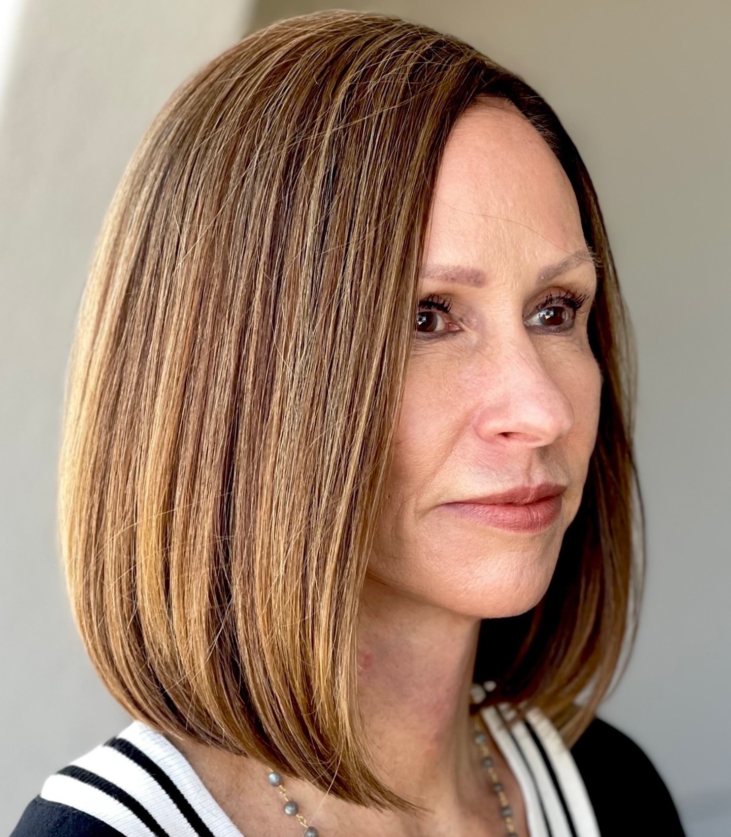 Sleek Ash Brown Bob — Winter Haircuts for Women Over 40
