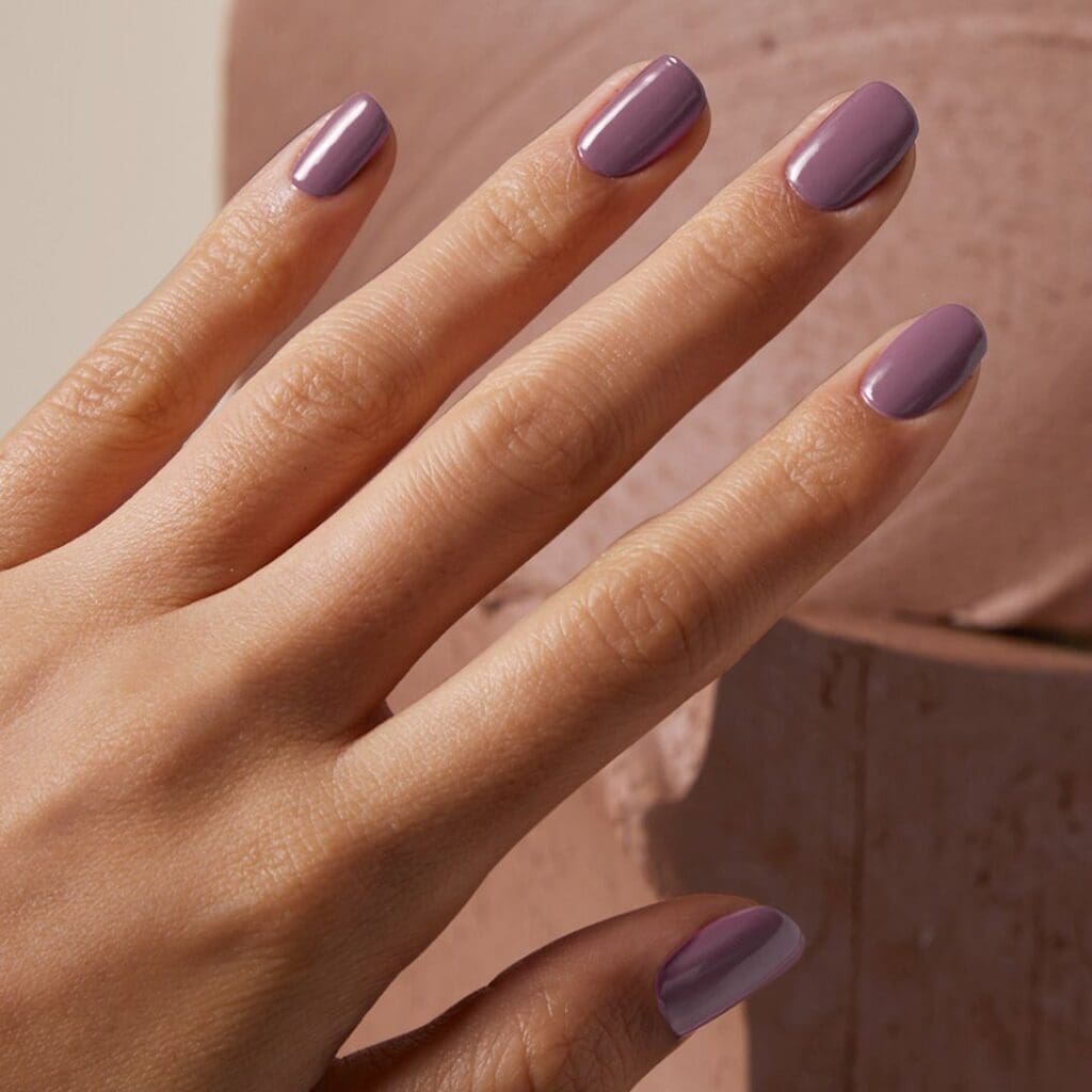 Glossy Muted Mauve Grey Oval Glossy Muted Mauve Grey Oval β Winter Nail Colors for Brown Skin