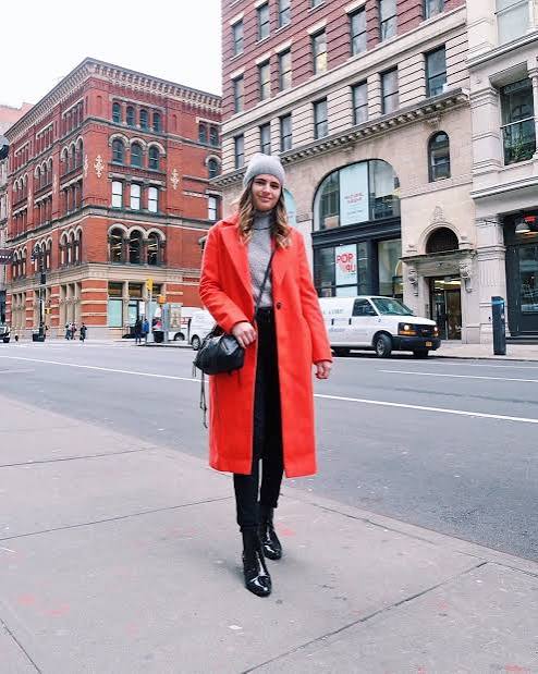 Vibrant Orange Coat Over Grey Turtleneck and Black Trousers — January Outfits