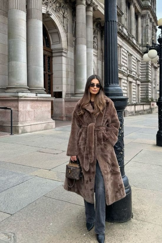 Belted Faux Fur Coat over Knit Top and Jeans Belted Faux Fur Coat over Knit Top and Jeans β Warm Winter Outfits