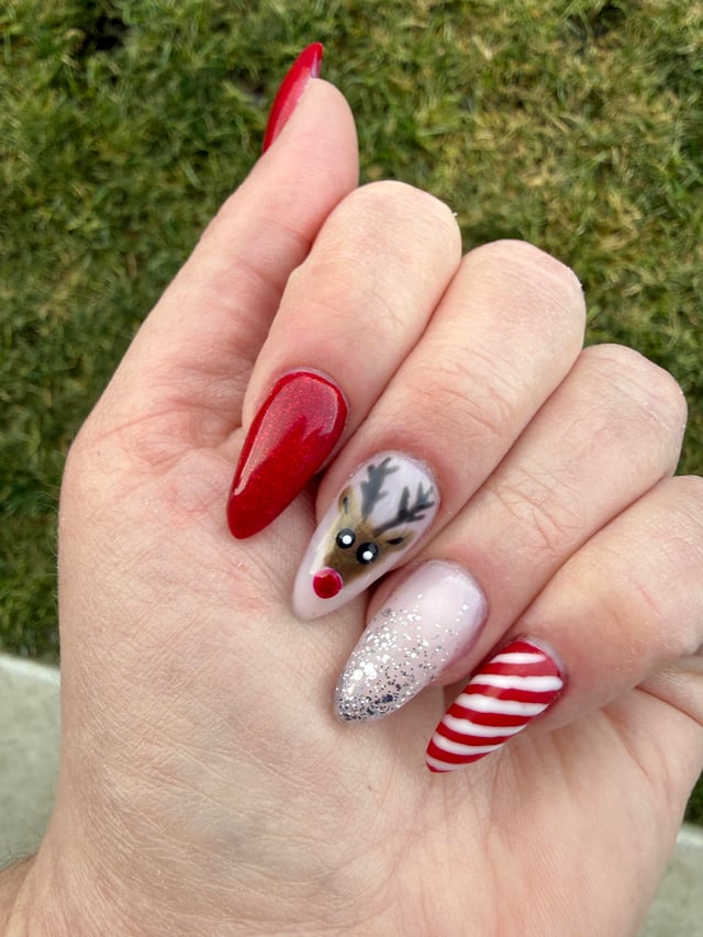 Festive Reindeer and Candy Cane Stilettos Festive Reindeer and Candy Cane Stilettos β Christmas Gel X Nails 2026